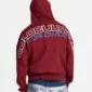 Vista trasera de la sudadera Holeshot Burgundy de Cold Culture, con capucha puesta y estampado Cold Culture Worldwide en blanco y azul.