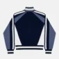 Vista trasera del jersey Pole Knit Navy de Cold Culture, con paneles geométricos en azul marino, azul grisáceo y blanco y ribetes de rayas.